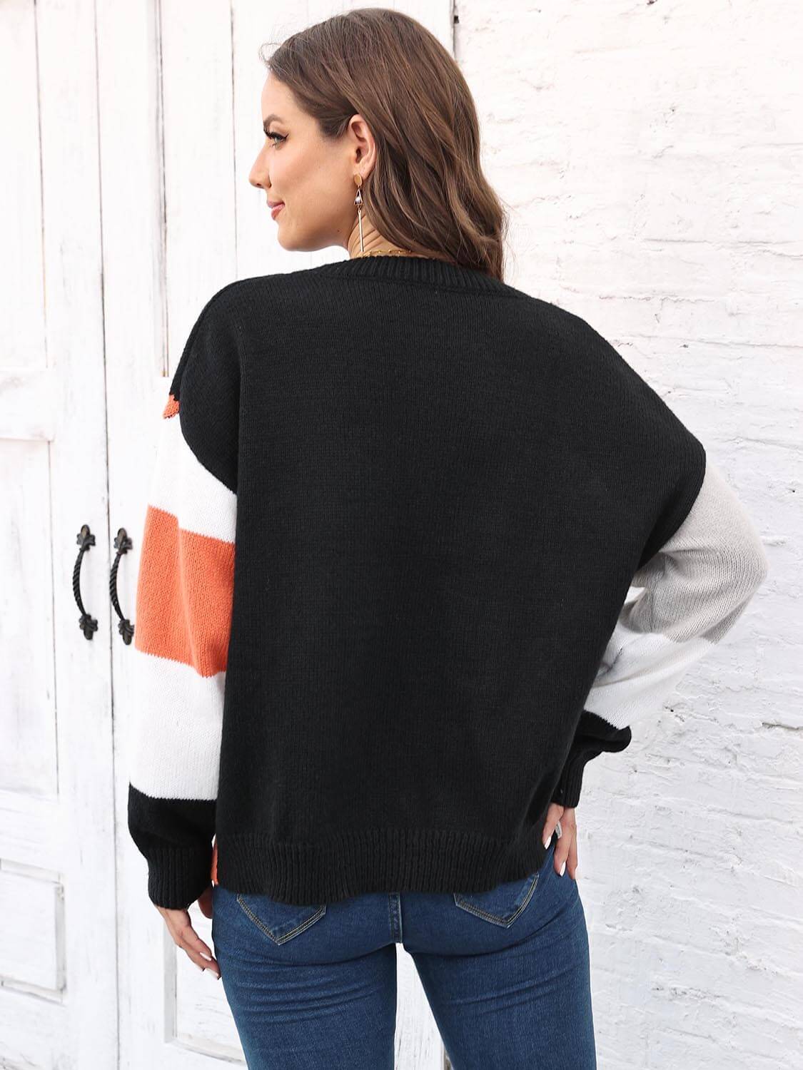 Color Block Round Neck Sweater shown from the back, featuring black, orange, and gray color blocks.