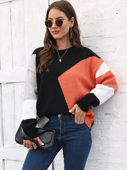 Color Block Round Neck Sweater with orange, gray, and black color blocks, paired with skinny jeans and sunglasses.
